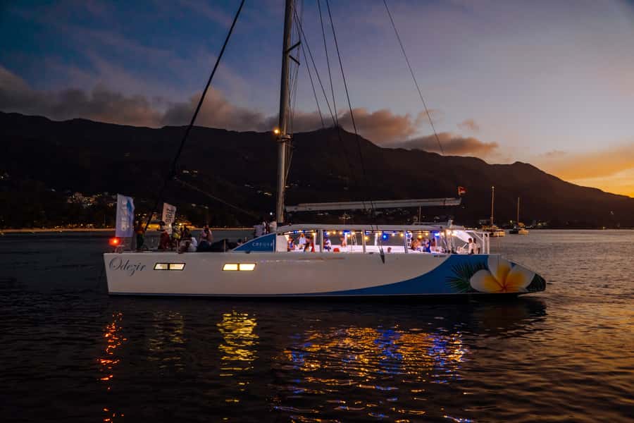 From Mahé: Seychelles Sunset Cruise with Hotel Transfers - Sunset, sparkling wine, and island music